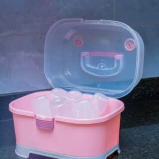 Compact Baby Bottle Drying Rack with Secure Closure and Storage Tray