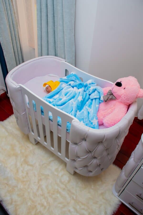 Elegant Designer Baby Cot with Satin-Cushioned Panels and Canopy Drape